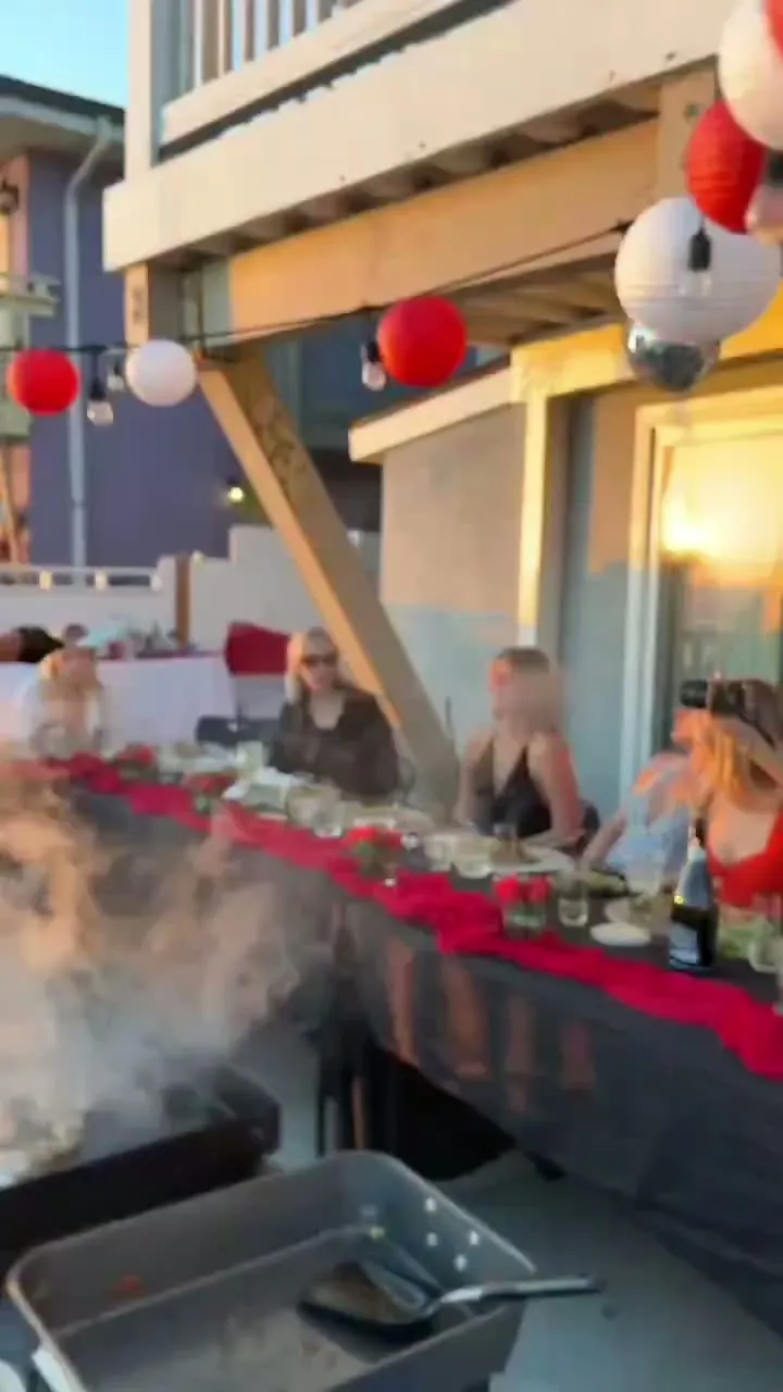 Video of an oceanfront sunset hibachi dinner party with lanterns in Southern California