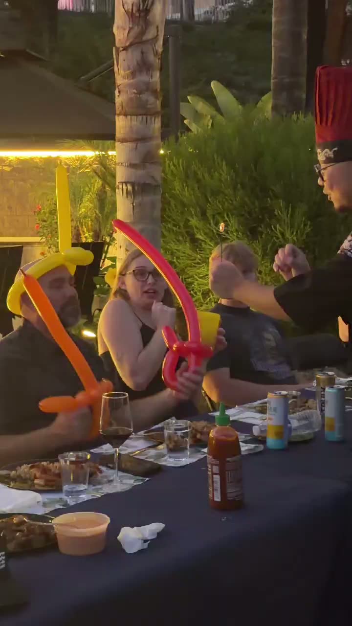Video of guests with balloon hats having fun at a Real Hibachi sunset dinner