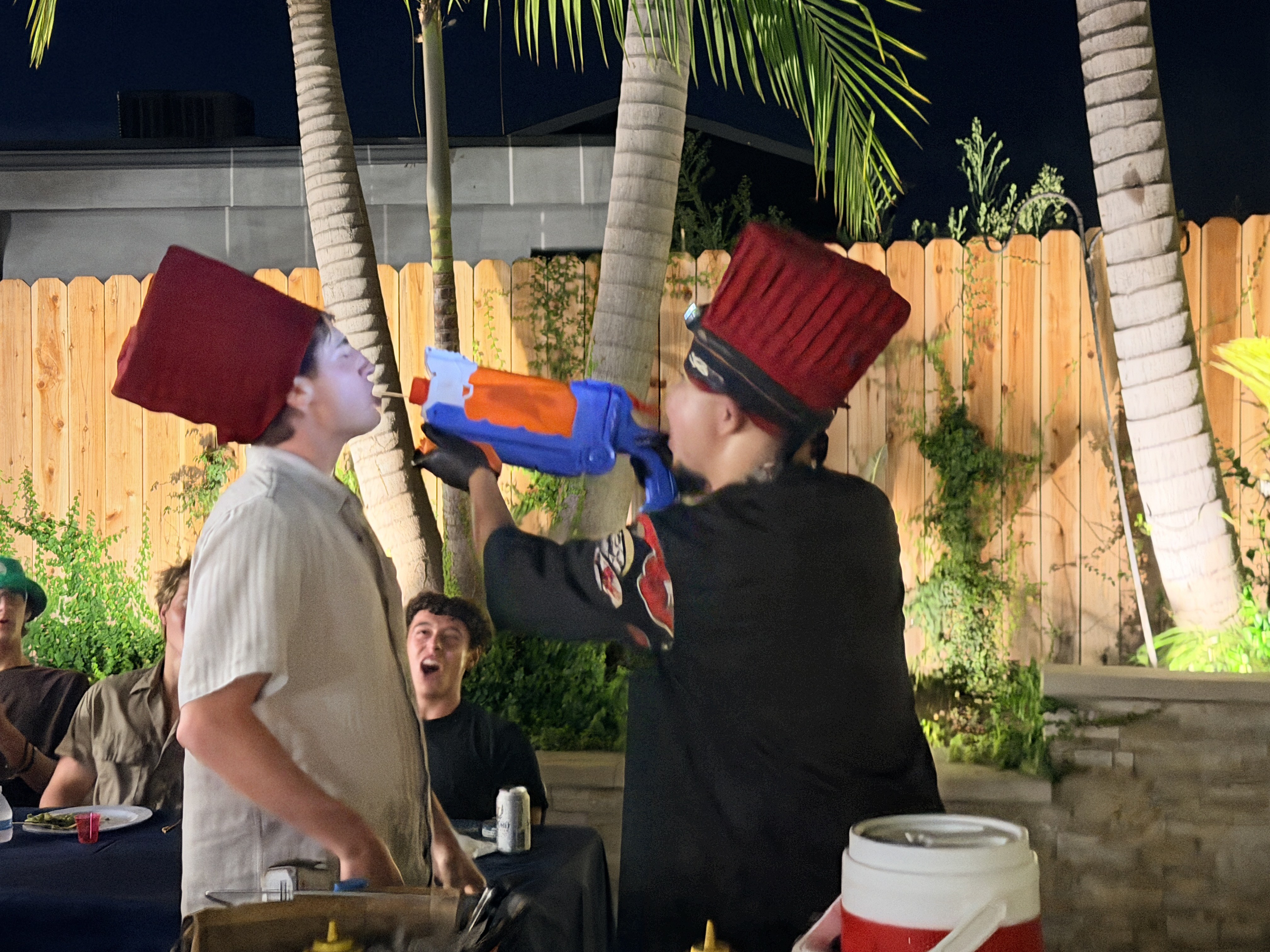 Hibachi chef game with laughing party guests